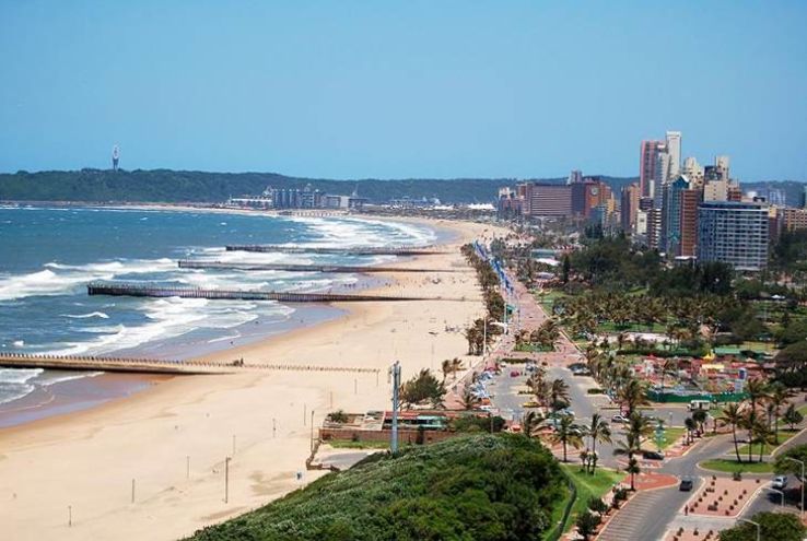 Aerial view of Durban's Golden Mile with beaches, promenade, and ocean waves along the coast of KwaZulu-Natal, South Africa.