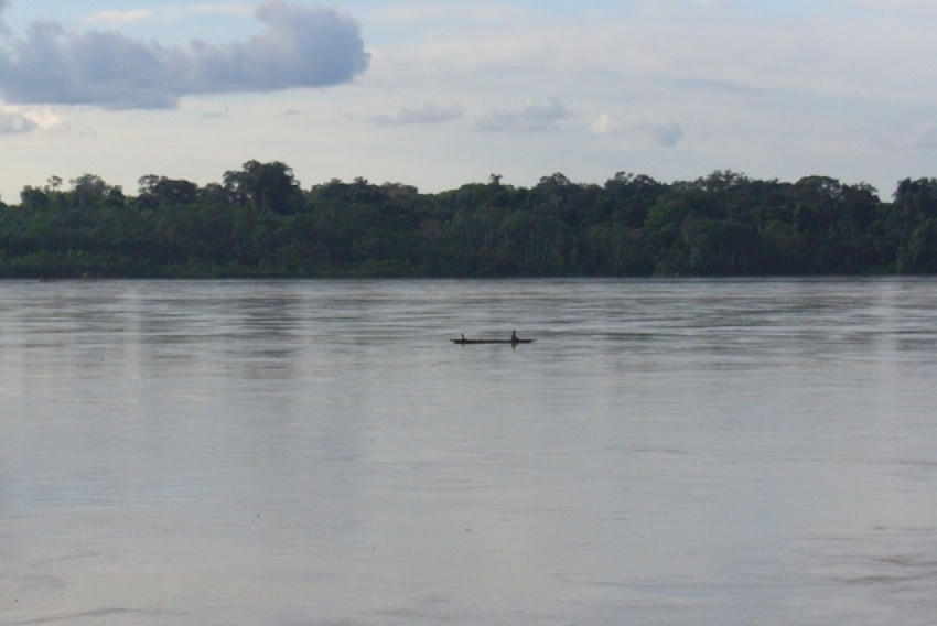 On a dugout canoe in the Amazon Rainforest