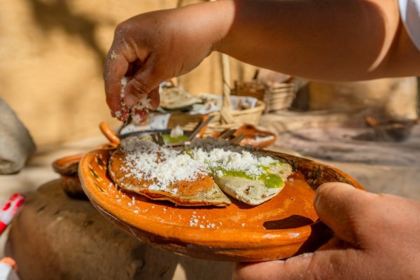 best food to try in Mexico corn tlacoyo with beans and salsa