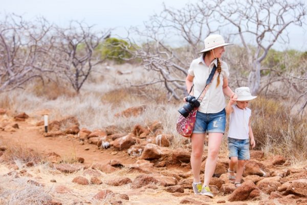 Mother and daughter hiking at North Seymour, Galapagos islands, Ecuador
