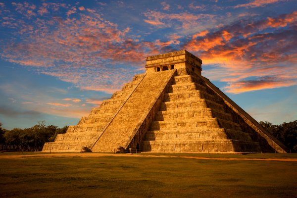 Mesoamerican step pyramid at Chichen Itza at sunset