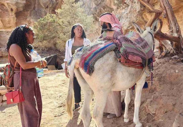 Safe to visit, tourist interacting with a local